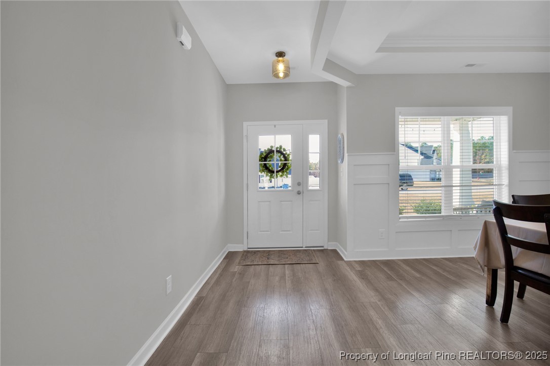 248 Rainy Beck Way Erwin, NC 28339 - Photo 4 of 44 wooden floor in an empty room with a window