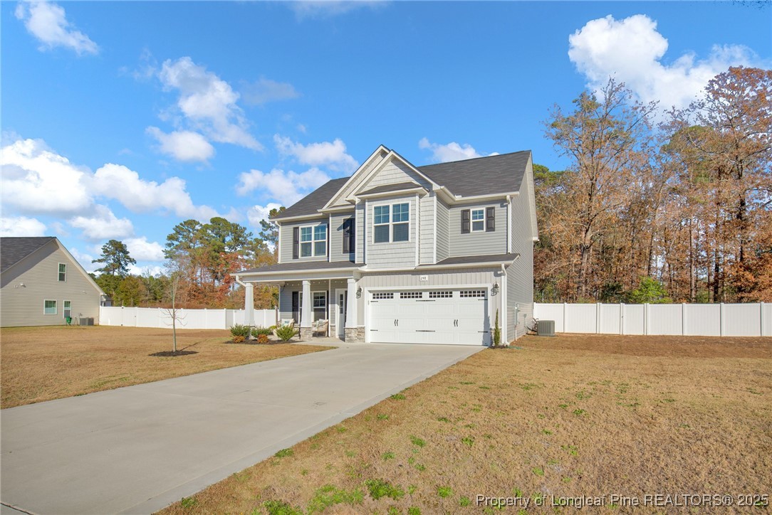 248 Rainy Beck Way Erwin, NC 28339 - Photo 43 of 44 a front view of a house with a yard
