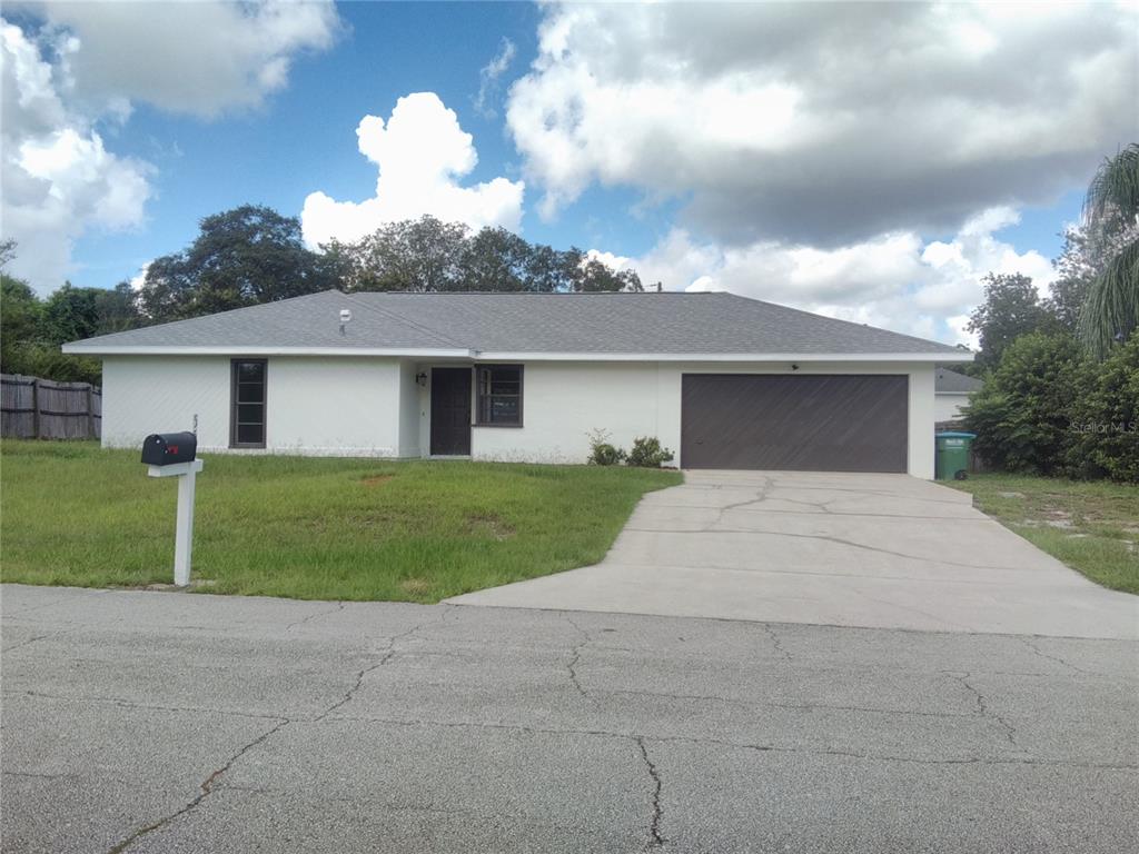 558 Geraldine Drive Deltona, FL 32725 - Photo 1 of 1 a front view of house with yard and green space