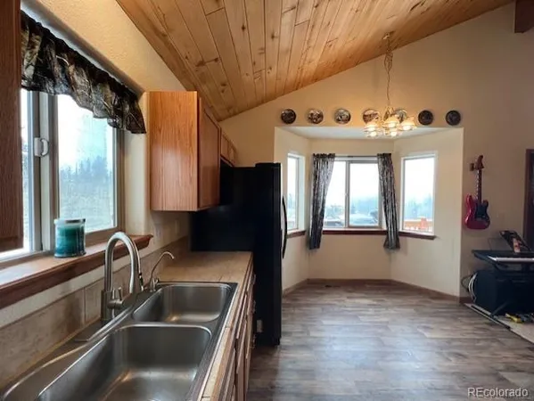 a kitchen with a sink and a refrigerator