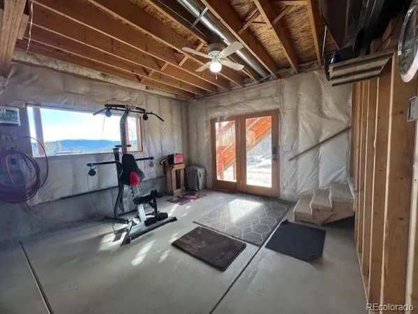 a view of gym equipment with windows