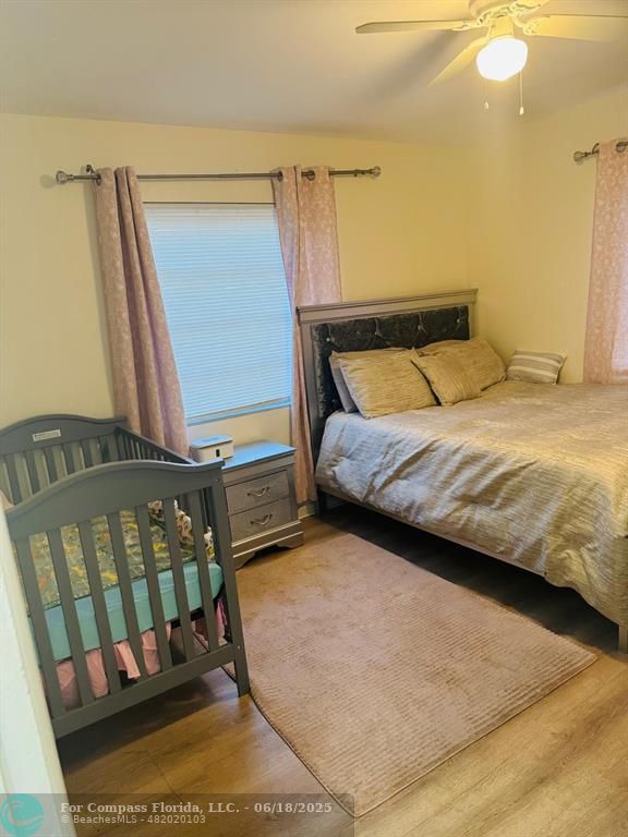 958 West 4th Street Riviera Beach, FL 33404 - Photo 12 of 13 a bedroom with a bed next to a window