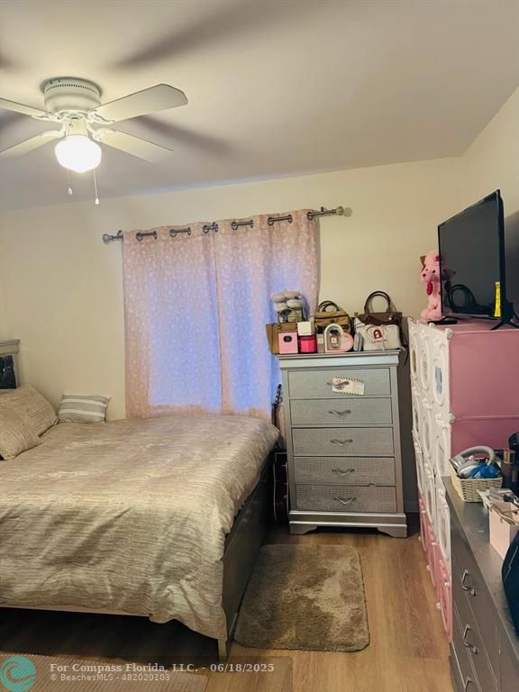 958 West 4th Street Riviera Beach, FL 33404 - Photo 13 of 13 a bedroom with a bed and a tv