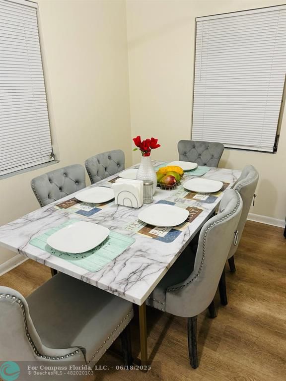 958 West 4th Street Riviera Beach, FL 33404 - Photo 2 of 13 a dining room with furniture and wooden floor