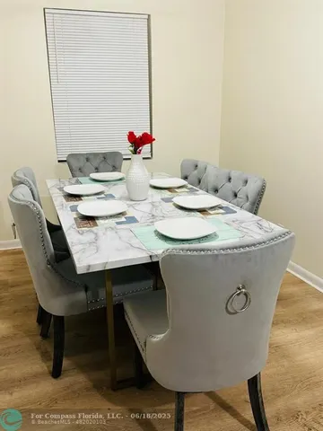 a view of a dining room with furniture