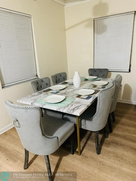 958 West 4th Street Riviera Beach, FL 33404 - Photo 4 of 13 a dining table with a sink and a mirror