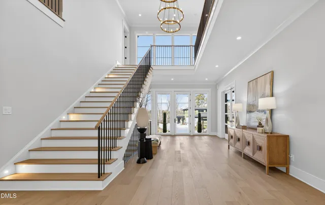 a living room with furniture a fireplace and a large window
