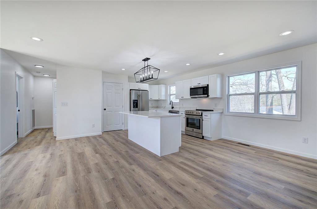 516 Baxter Road Southeast Calhoun, GA 30701 - Photo 19 of 47 a view of a kitchen with microwave and cabinets