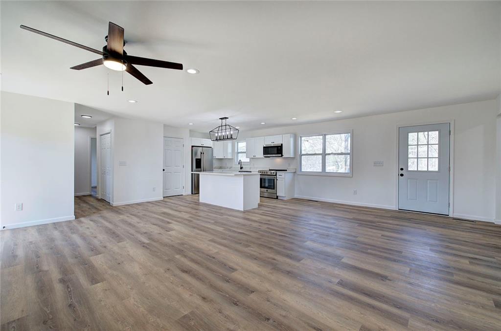 516 Baxter Road Southeast Calhoun, GA 30701 - Photo 21 of 47 a view of empty room with wooden floor and ceiling fan