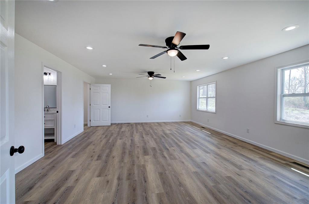 516 Baxter Road Southeast Calhoun, GA 30701 - Photo 23 of 47 a view of empty room with wooden floor and window