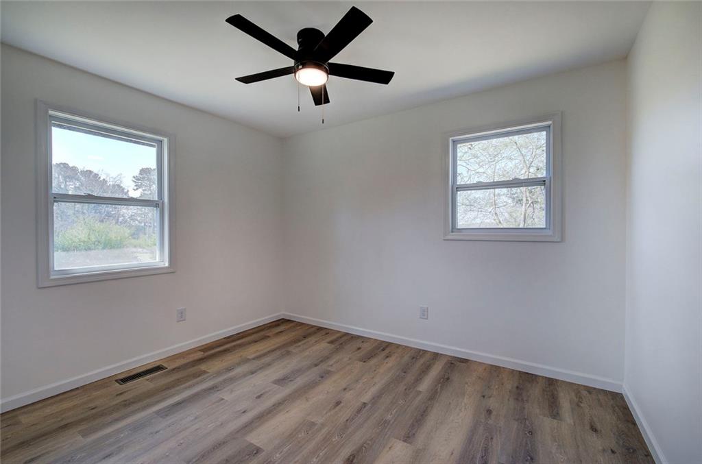 516 Baxter Road Southeast Calhoun, GA 30701 - Photo 29 of 47 wooden floor in an empty room with a window