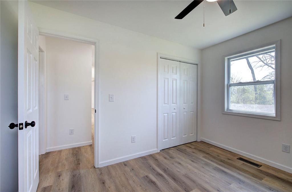 516 Baxter Road Southeast Calhoun, GA 30701 - Photo 30 of 47 an empty room with windows and closet