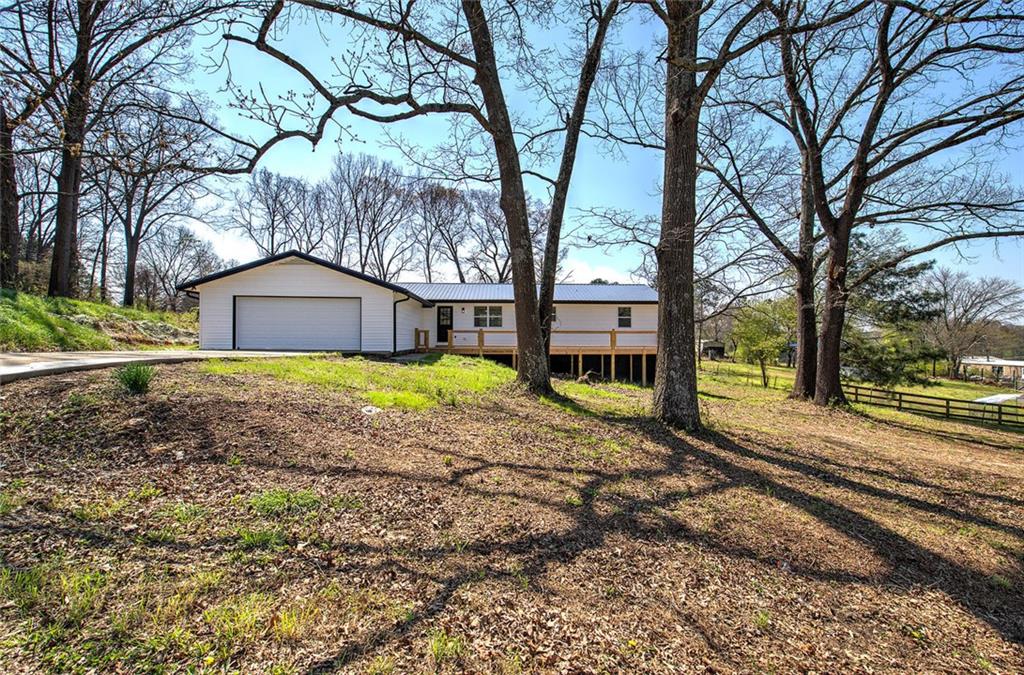 516 Baxter Road Southeast Calhoun, GA 30701 - Photo 3 of 47 a house that has a tree in front of it