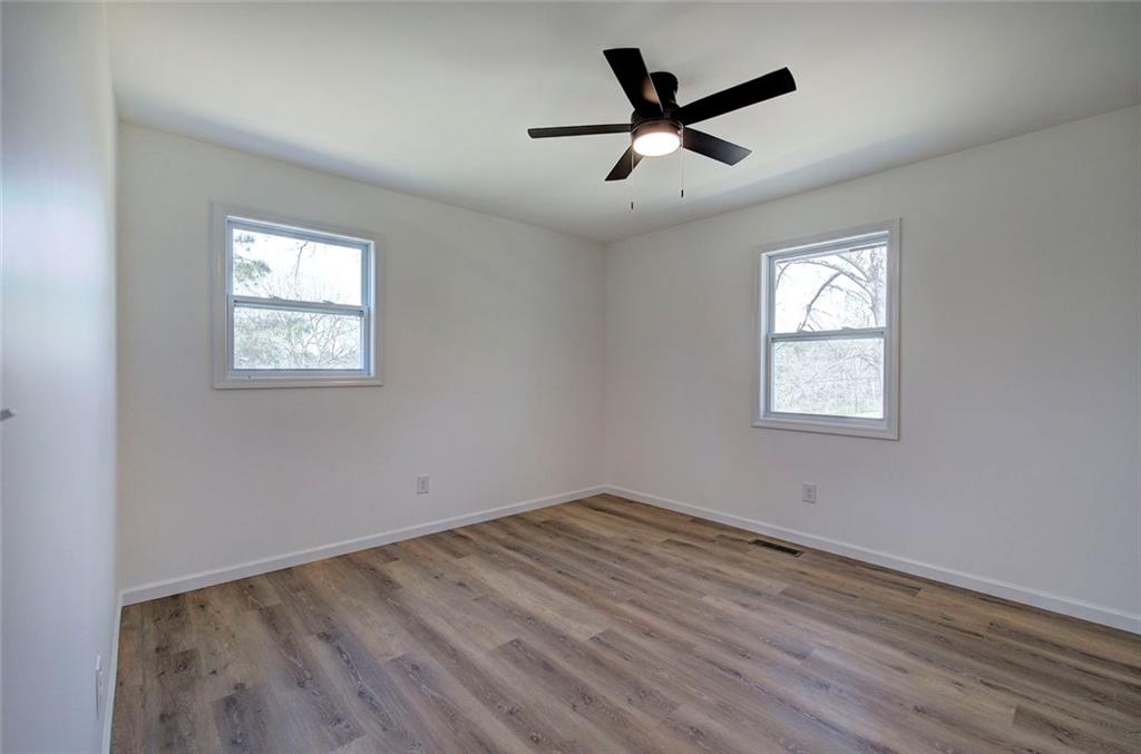 516 Baxter Road Southeast Calhoun, GA 30701 - Photo 33 of 47 wooden floor in an empty room with a window