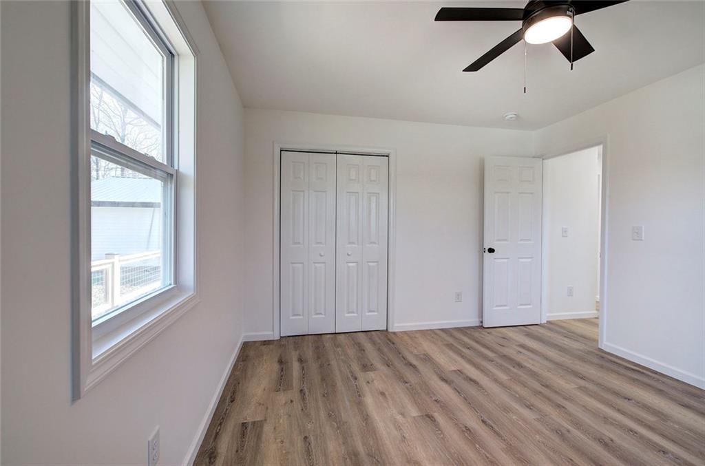 516 Baxter Road Southeast Calhoun, GA 30701 - Photo 34 of 47 a view of empty room with wooden floor and window