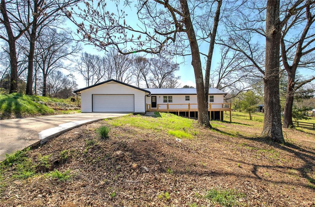 516 Baxter Road Southeast Calhoun, GA 30701 - Photo 46 of 47 a house with trees in front of it
