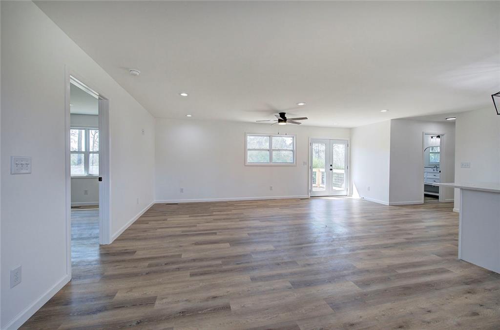 516 Baxter Road Southeast Calhoun, GA 30701 - Photo 10 of 47 a view of an empty room with wooden floor and a window