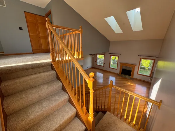 a view of an entryway with wooden floor