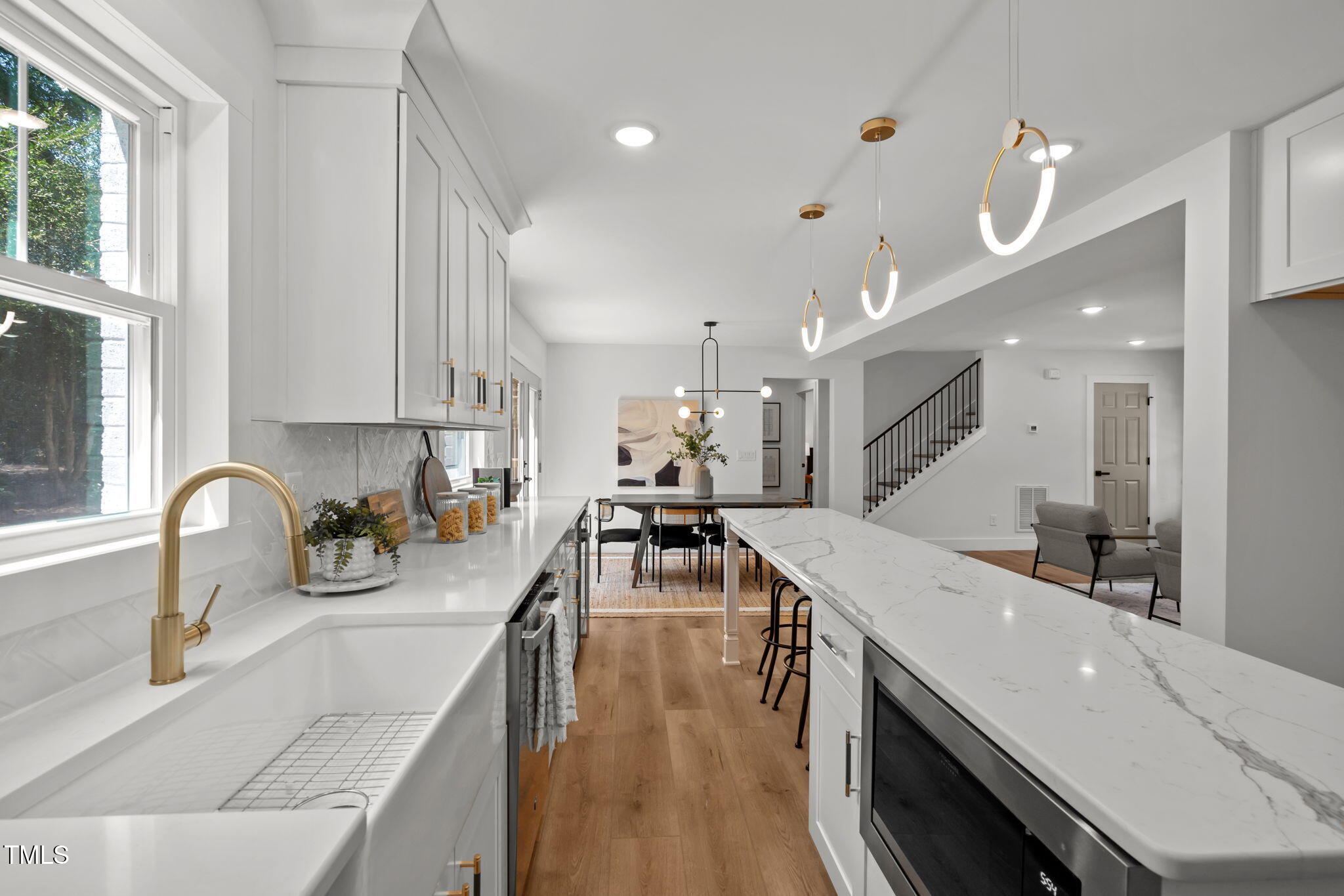 2801 Ashland Street Raleigh, NC 27608 - Photo 14 of 44 a kitchen with counter top space a sink and appliances