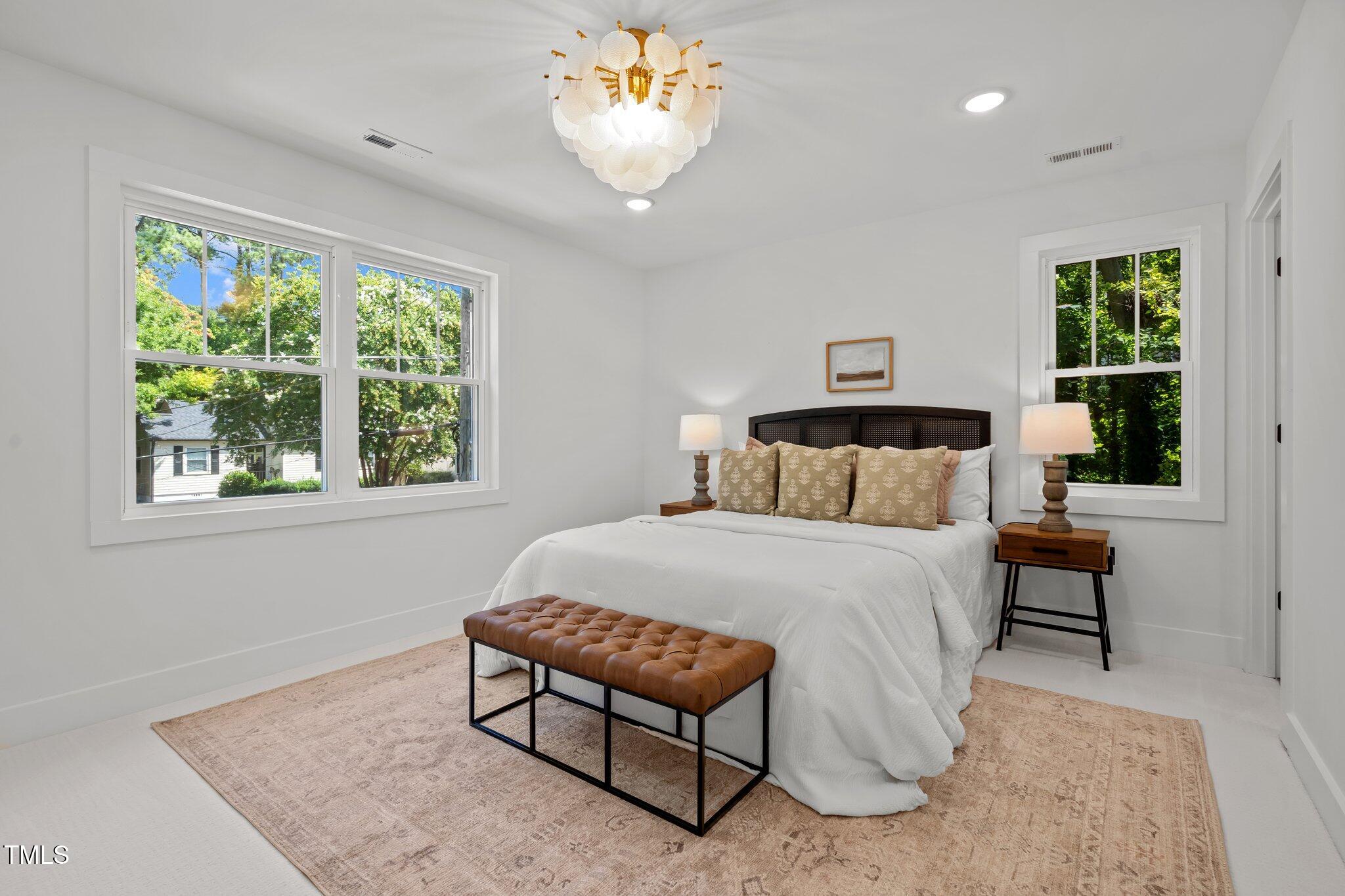2801 Ashland Street Raleigh, NC 27608 - Photo 17 of 44 a bedroom with a bed and window