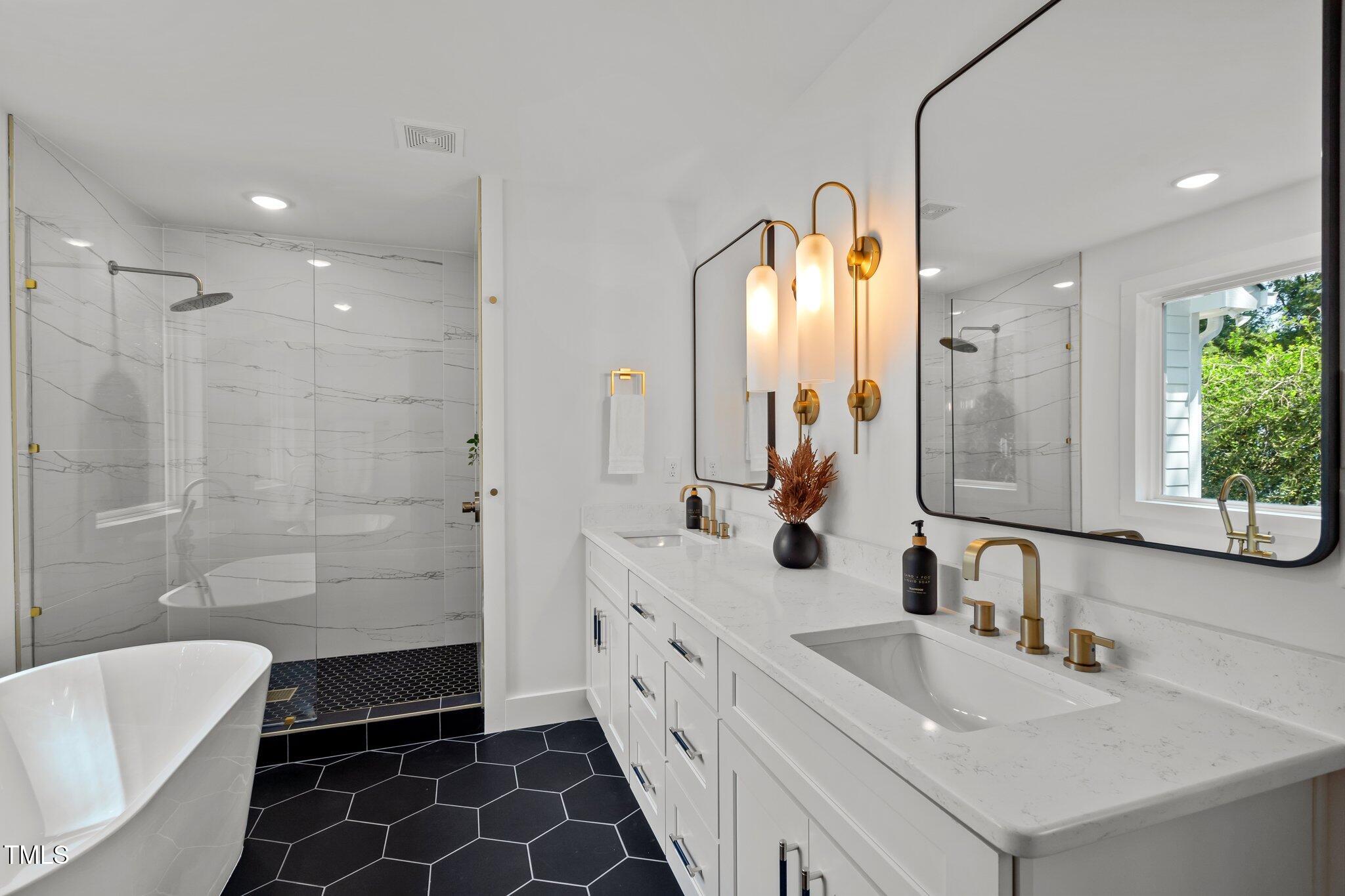 2801 Ashland Street Raleigh, NC 27608 - Photo 19 of 44 a bathroom with a double vanity sink mirror double and shower