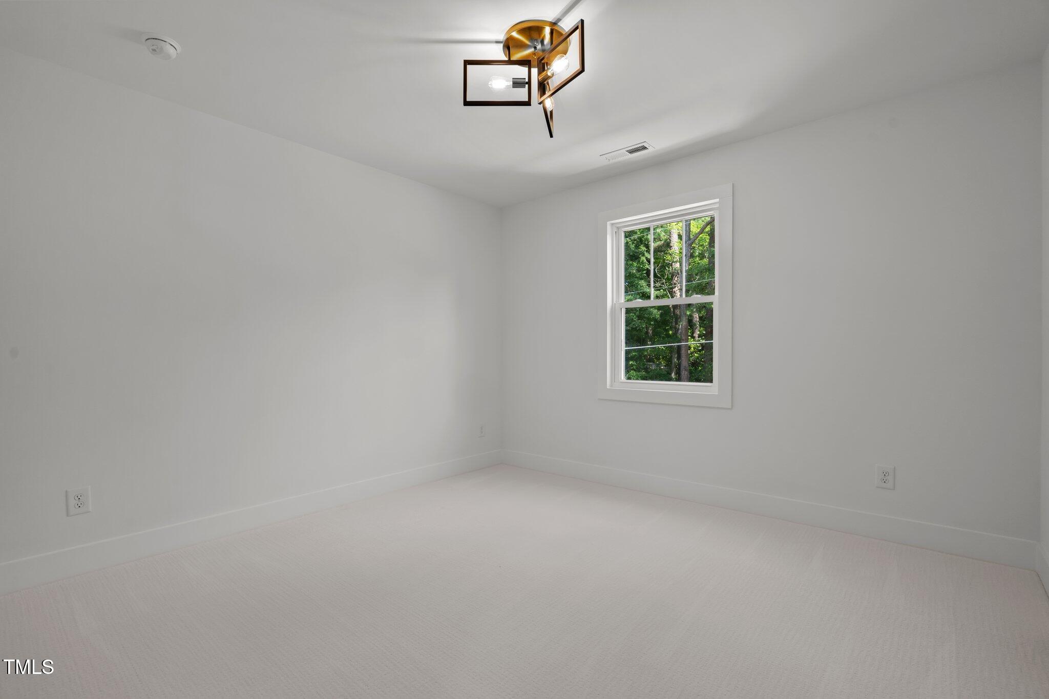 2801 Ashland Street Raleigh, NC 27608 - Photo 26 of 44 an empty room with windows