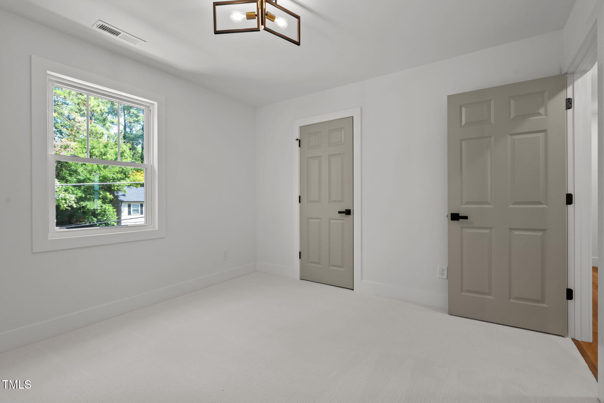 2801 Ashland Street Raleigh, NC 27608 - Photo 33 of 44 a big room with closet and windows