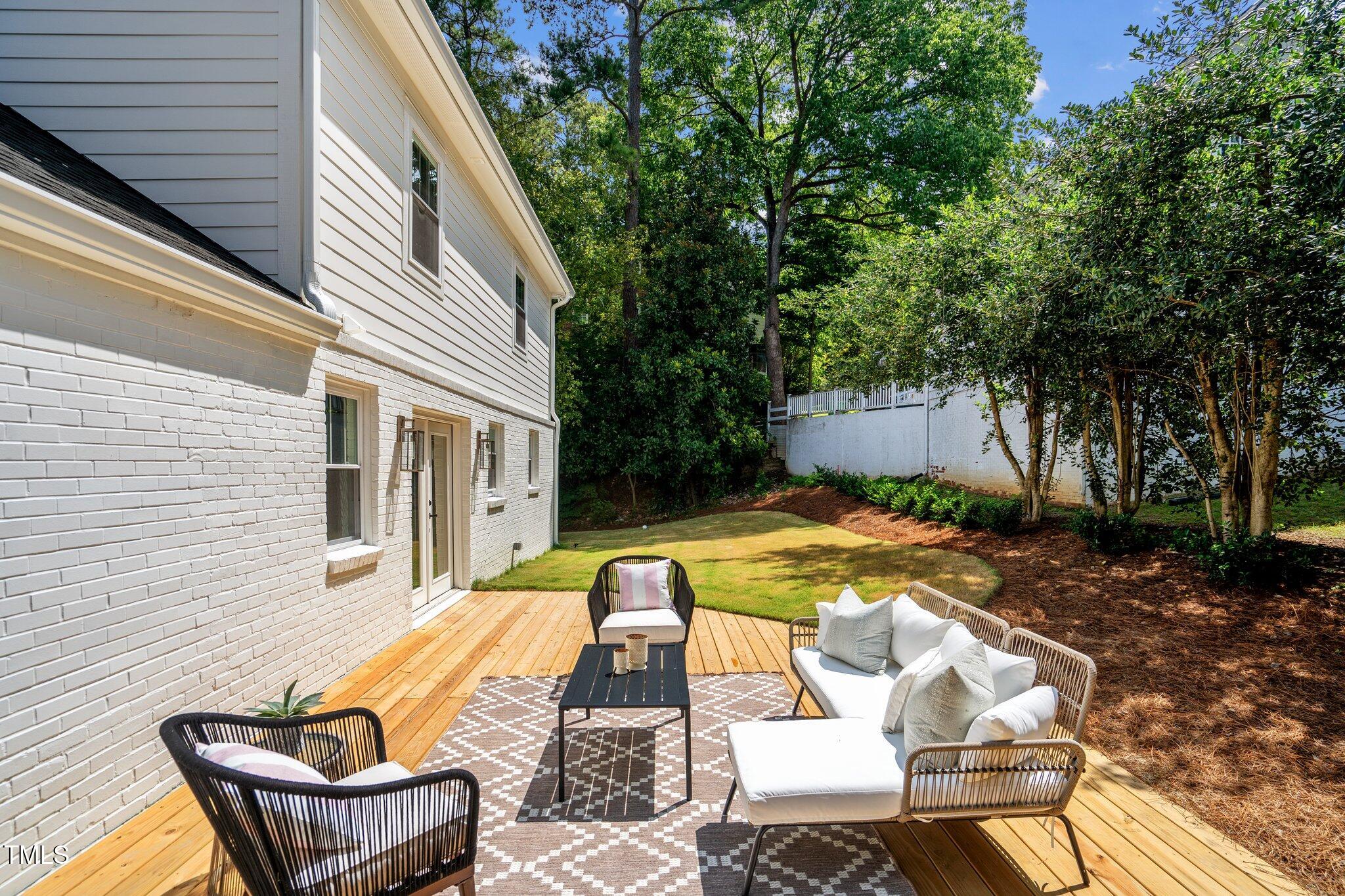 2801 Ashland Street Raleigh, NC 27608 - Photo 37 of 44 a view of a house with backyard and sitting area