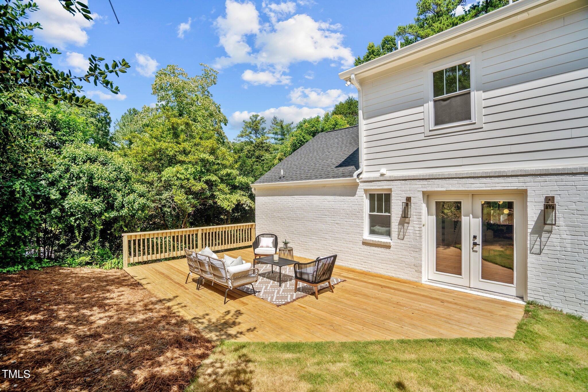 2801 Ashland Street Raleigh, NC 27608 - Photo 38 of 44 a view of a house with backyard and sitting area