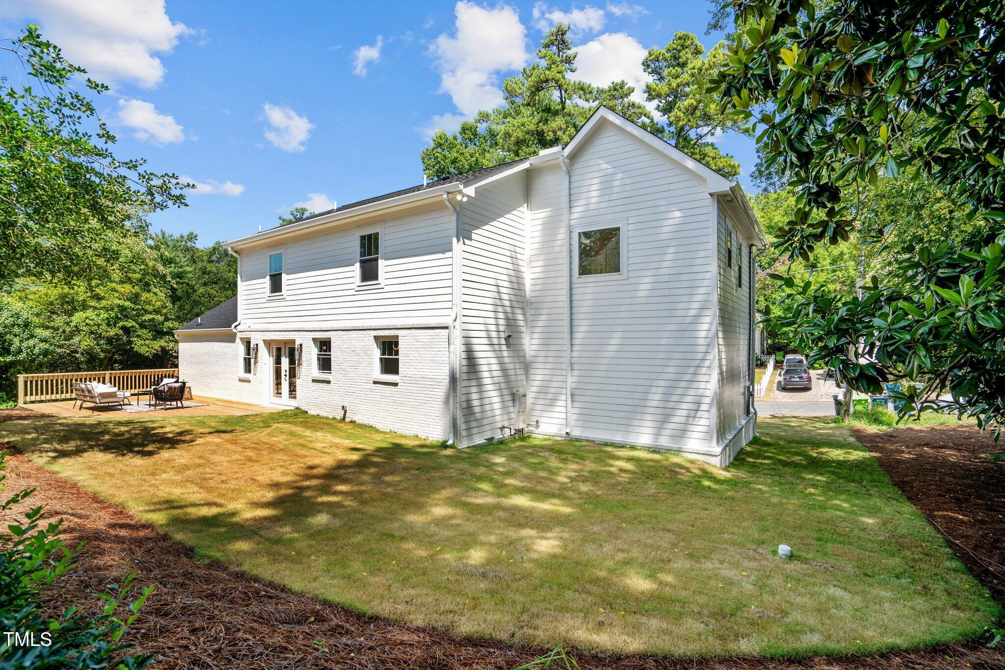 2801 Ashland Street Raleigh, NC 27608 - Photo 39 of 44 a view of a house with a yard