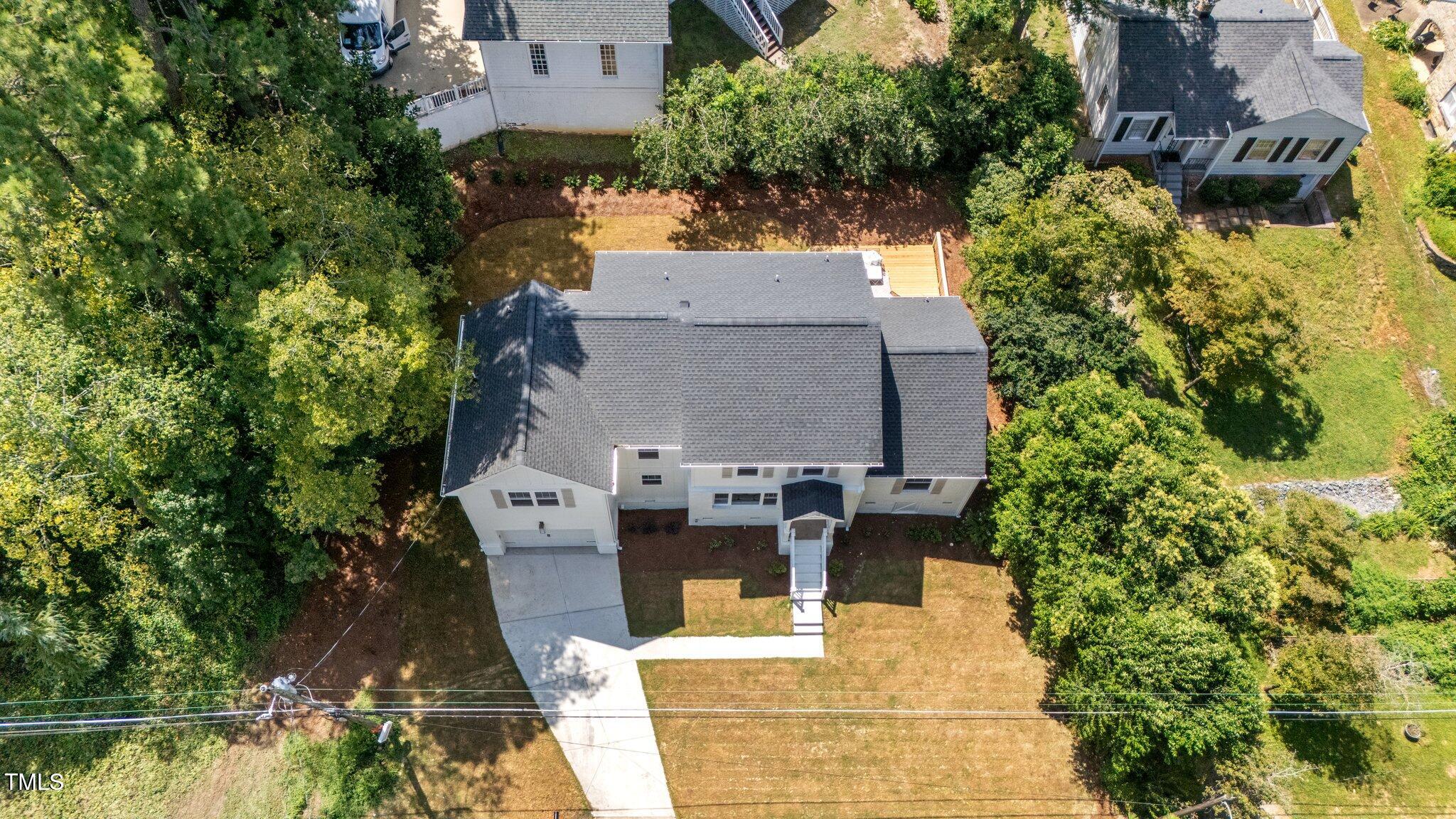 2801 Ashland Street Raleigh, NC 27608 - Photo 43 of 44 an aerial view of a house with a yard and swimming pool