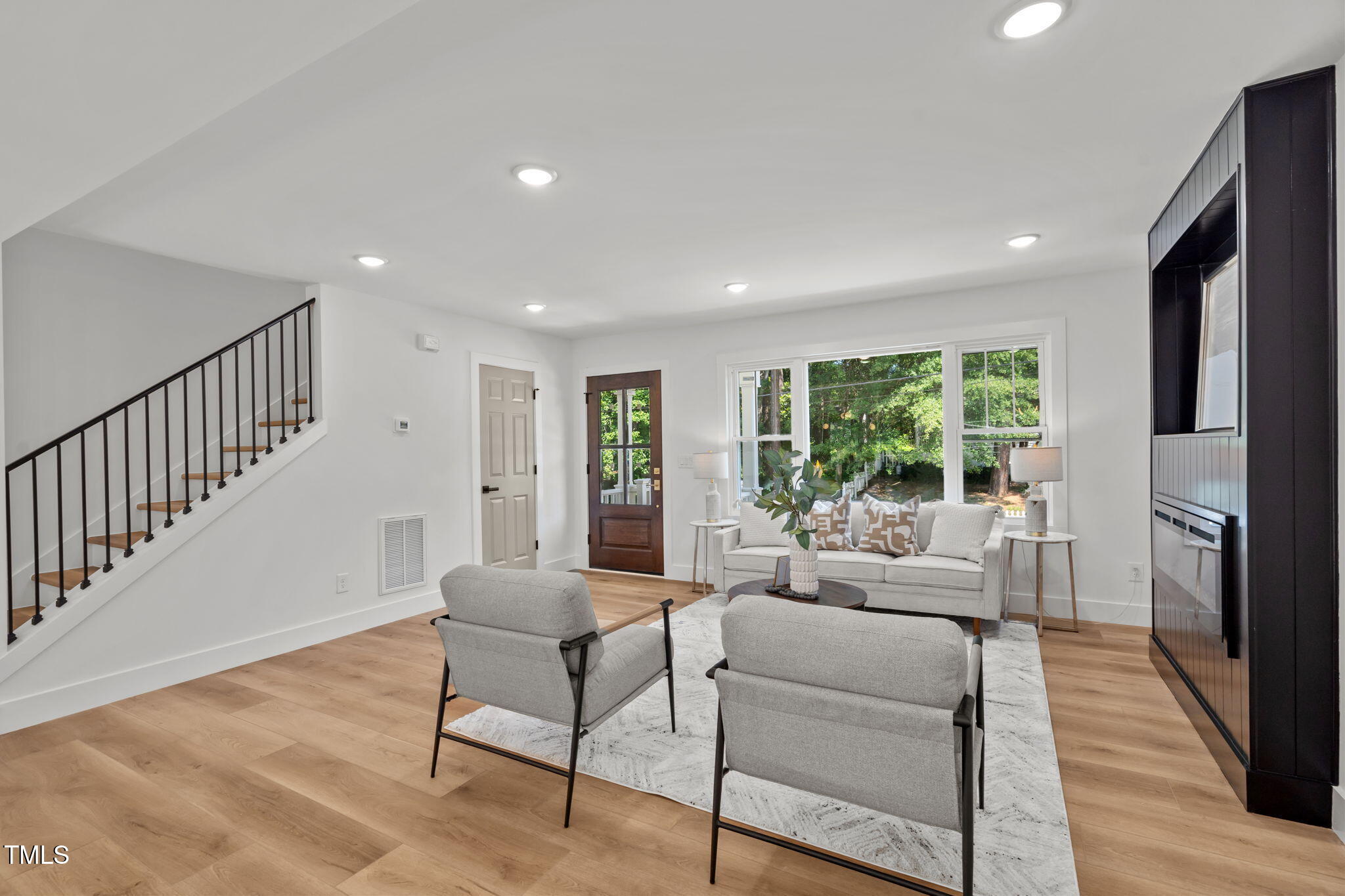 2801 Ashland Street Raleigh, NC 27608 - Photo 6 of 44 a living room with furniture and a wooden floor