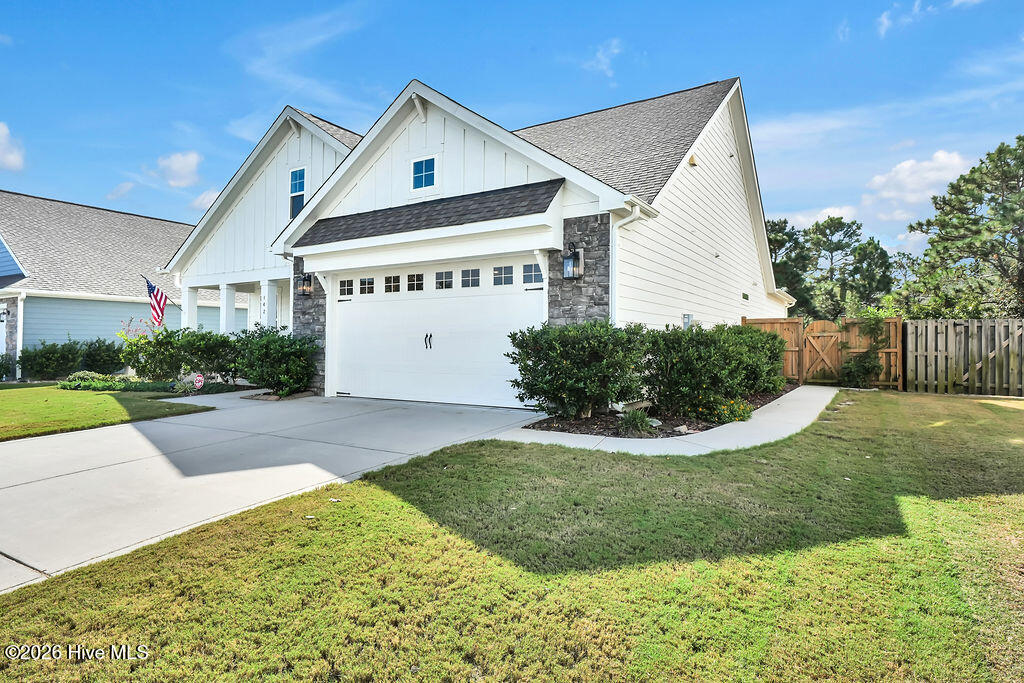 142 Rice Marsh Way Wilmington, NC 28412 - Photo 53 of 64 You'll love this added private sidewalk connecting the driveway to the backyard gate for a no-fuss transition.