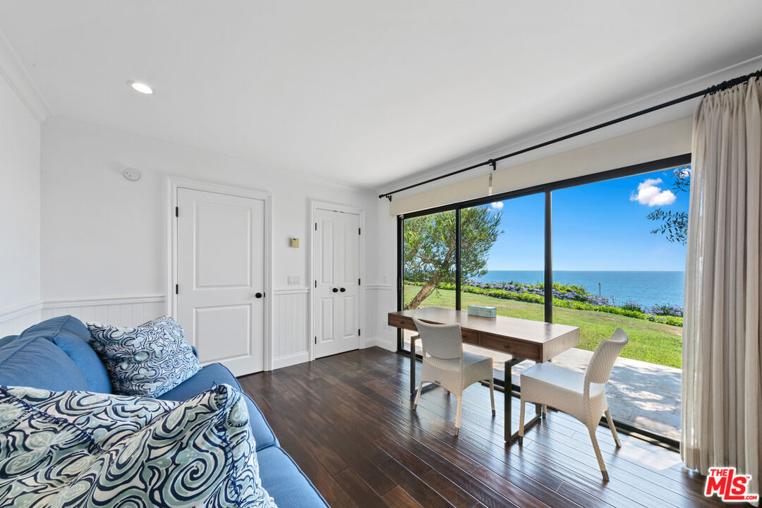 6801 Shearwater Lane Malibu, CA 90265 - Photo 18 of 33 a living room with furniture and large windows