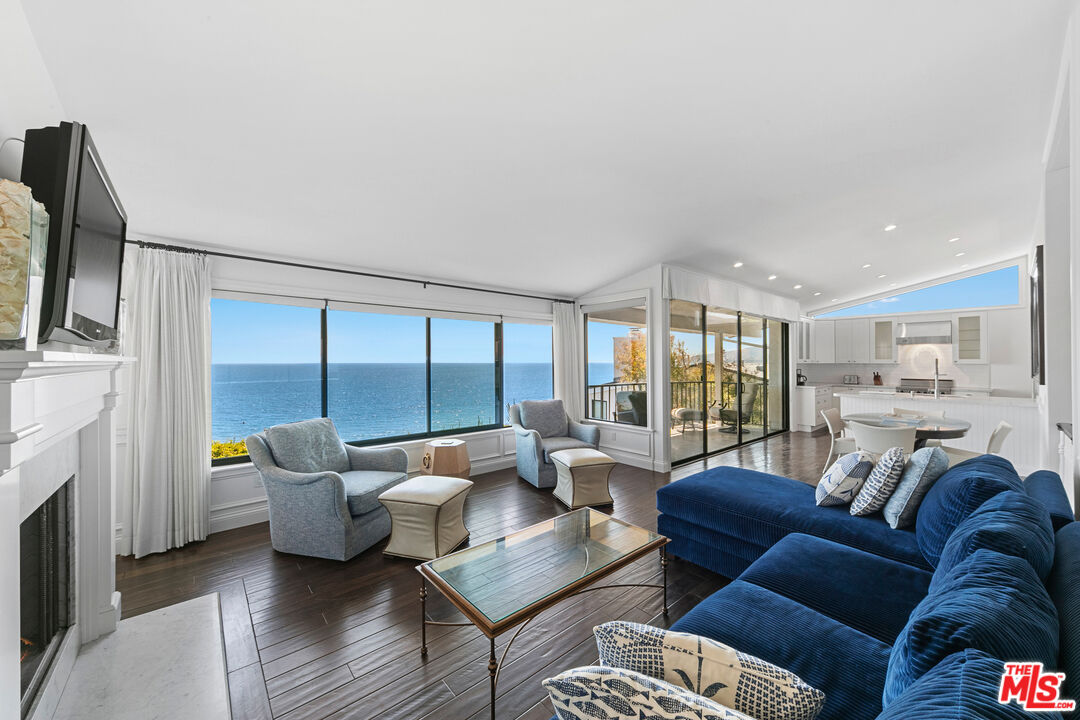 6801 Shearwater Lane Malibu, CA 90265 - Photo 7 of 33 a living room with furniture and large windows