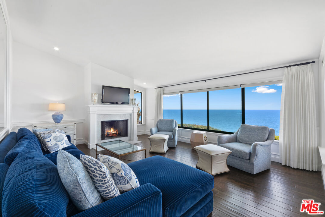6801 Shearwater Lane Malibu, CA 90265 - Photo 8 of 33 a living room with furniture and a fireplace