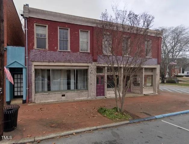 a front view of a house with yard