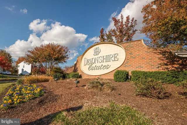 a sign that is sitting on a rock