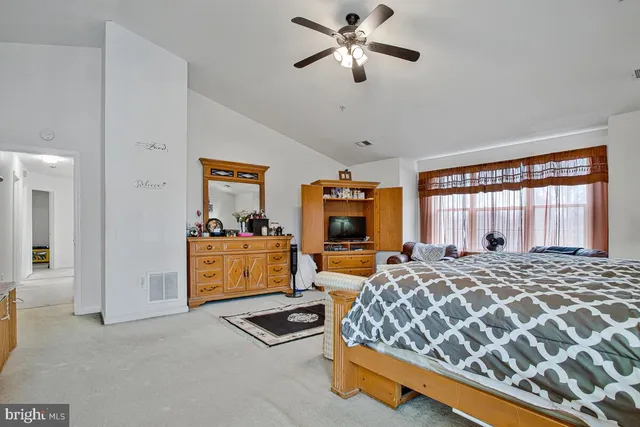 a bathroom with a double vanity sink a mirror and a bathtub