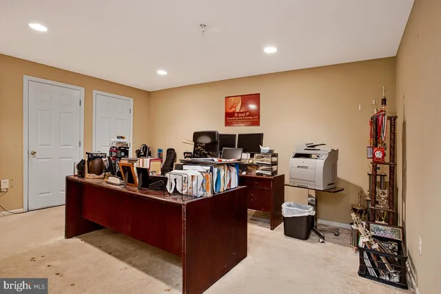 a view of a large pool with a big yard and large trees