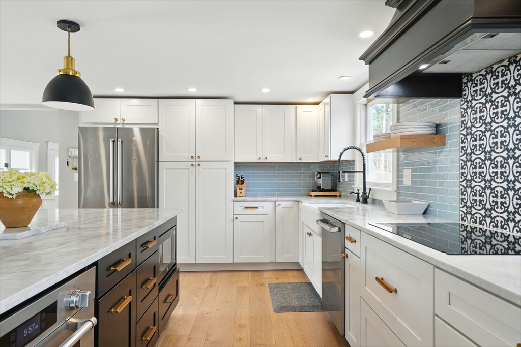 11 Old Oaken Bucket Road Norwell, MA 02061 - Photo 11 of 39 a kitchen with a sink refrigerator and cabinets