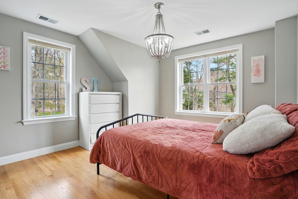 11 Old Oaken Bucket Road Norwell, MA 02061 - Photo 19 of 39 a bed sitting in a bedroom next to a window