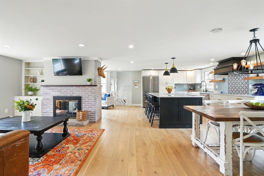 11 Old Oaken Bucket Road Norwell, MA 02061 - Photo 2 of 39 a living room with stainless steel appliances furniture a fireplace a flat screen tv and a fireplace