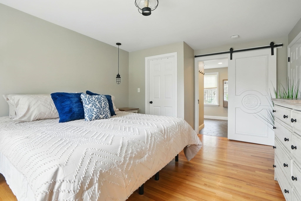 11 Old Oaken Bucket Road Norwell, MA 02061 - Photo 22 of 39 a bedroom with a bed and wooden floor