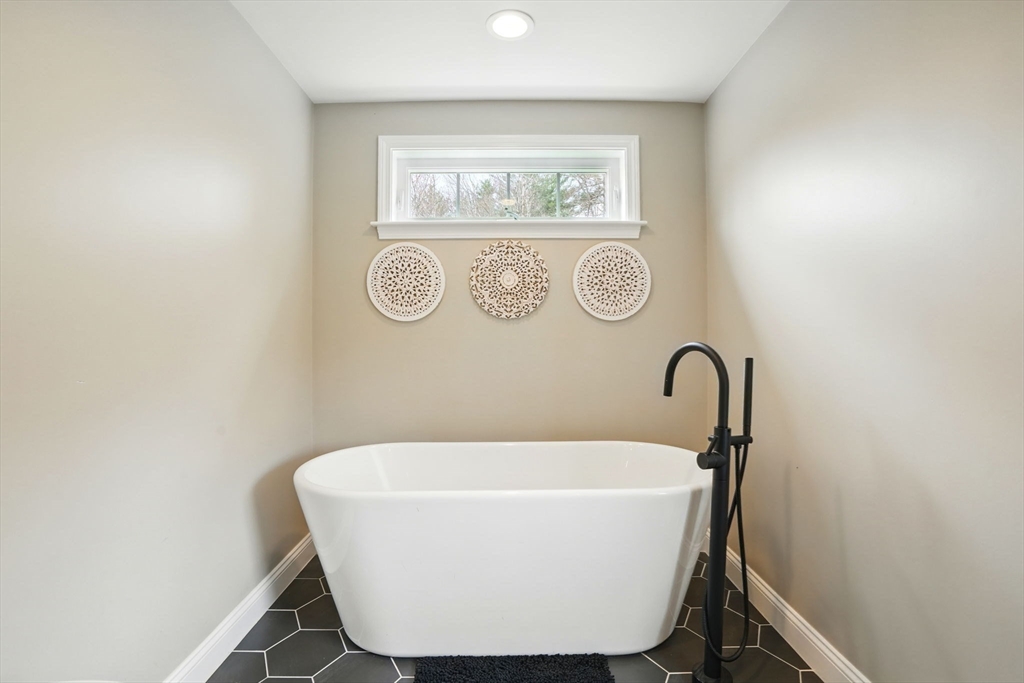 11 Old Oaken Bucket Road Norwell, MA 02061 - Photo 25 of 39 a white bath tub sitting in a bathroom