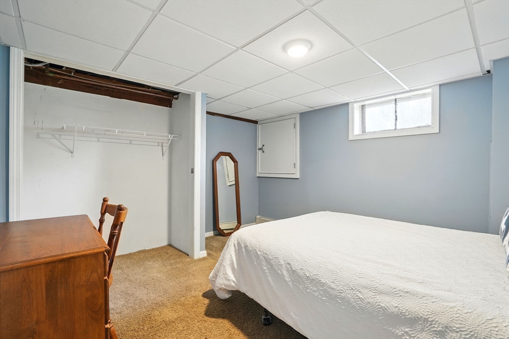 11 Old Oaken Bucket Road Norwell, MA 02061 - Photo 28 of 39 a bedroom with a bed and a chair