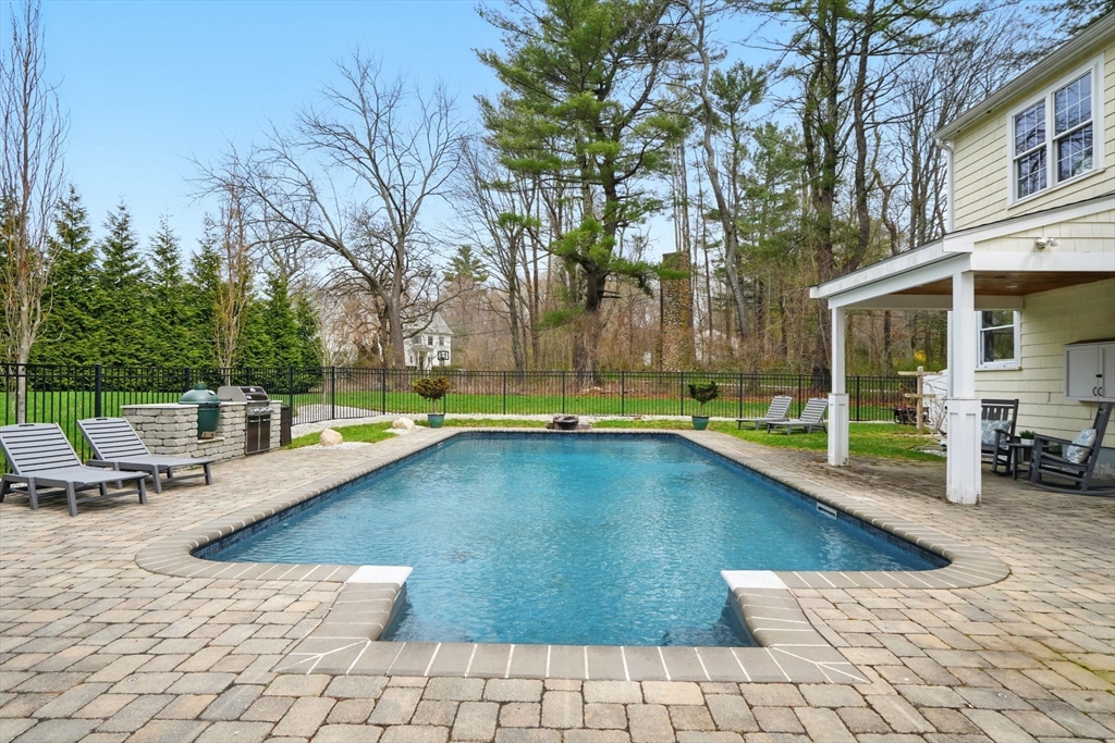 11 Old Oaken Bucket Road Norwell, MA 02061 - Photo 30 of 39 a view of swimming pool with seating space and trees in the background