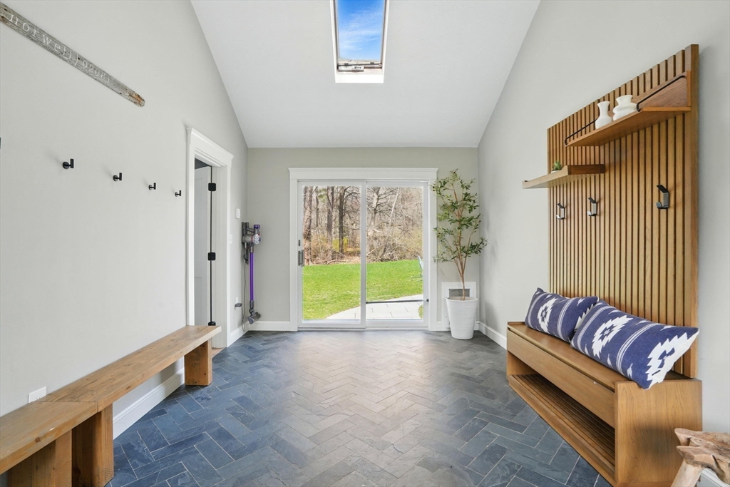 11 Old Oaken Bucket Road Norwell, MA 02061 - Photo 3 of 39 a view of an empty room with a fireplace and a window