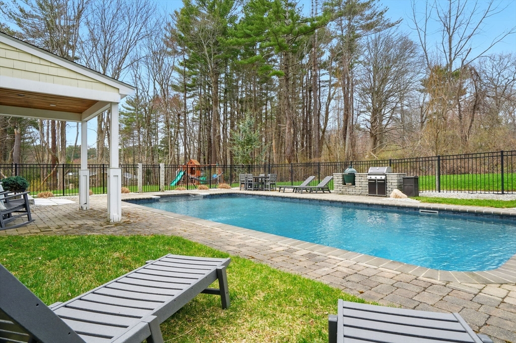 11 Old Oaken Bucket Road Norwell, MA 02061 - Photo 31 of 39 a view of a swimming pool with lounge chairs in patio