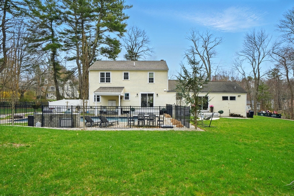 11 Old Oaken Bucket Road Norwell, MA 02061 - Photo 37 of 39 a front view of house with a garden and patio